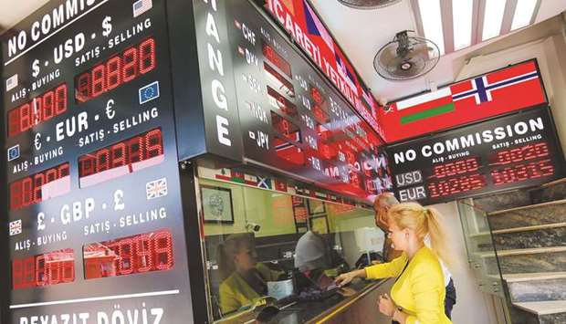 Customers at a currency exchange office in Istanbul. The lirau2019s depreciation poses upward risks to inflation due to Turkeyu2019s heavy import bill priced in hard currencies.