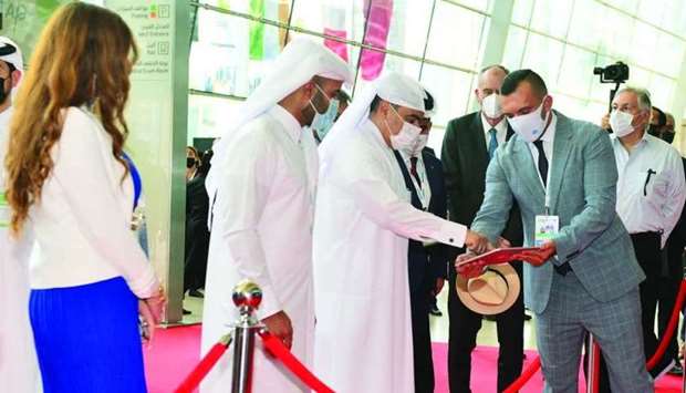 HE the Minister of Commerce and Industry and Acting Minister of Finance Ali bin Ahmed al-Kuwari using a tablet to initiate the opening of Project Qatar 2021 at the DECC. PICTURE: Shaji Kayamkulam.