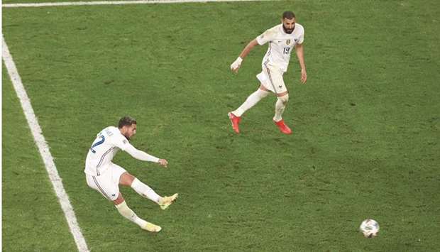 Franceu2019s Theo Hernandez (left) scores against Belgium in the Nations League semi-final in Turin on Thursday. (Reuters)