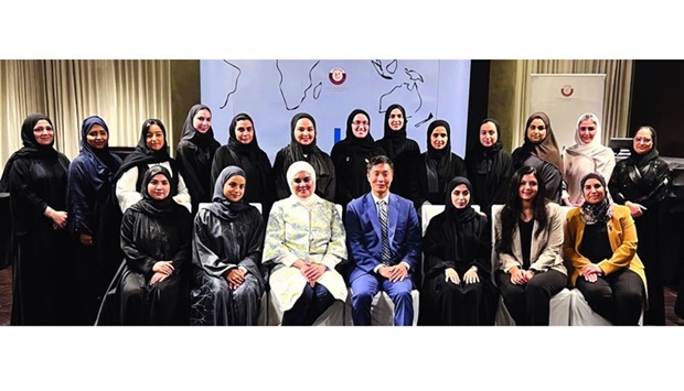 Zainab al-Suwaij (sitting, third left) with participants of an event in Doha.