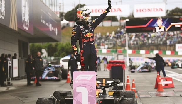 Red Bull Racingu2019s Dutch driver Max Verstappen celebrates on his car following his victory at the Formula One Japanese Grand Prix at Suzuka, Mie Prefecture, Japan, on Sunday. (AFP)