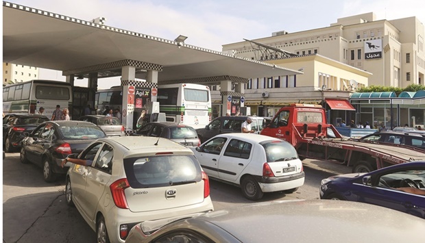 Cars queue for fuel at a gas station in Tunis, yesterday.