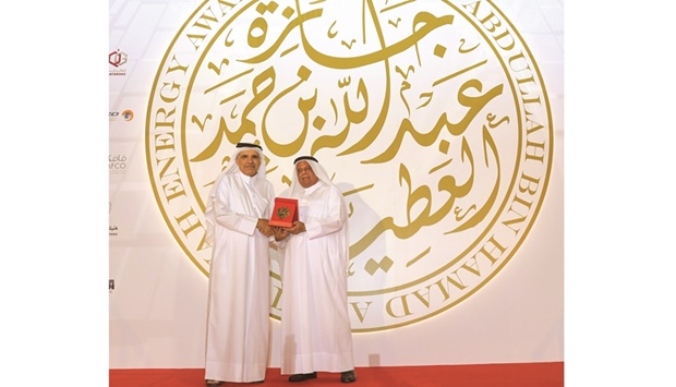 HE Abdullah bin Hamad al-Attiyah handing over the award to Fahad Hamad al-Mohannadi, who got the award for ,The advancement of Qatar's energy industry., PICTURE: Ram Chand