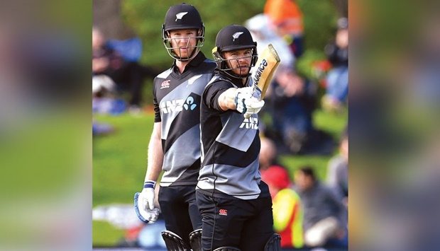 New Zealandu2019s Glenn Phillips (right) celebrates his half century with teammate James Neesham during the tri-series match against Bangladesh at Hagley Oval in Christchurch yesterday. (AFP)
