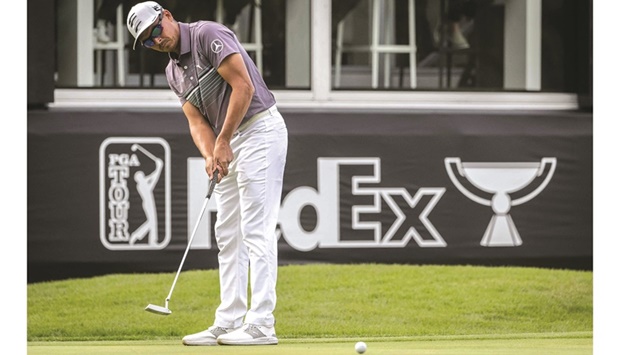 Rickie Fowler of the US putts during the second round of the Zozo Championship at the Accordia Golf Narashino Country Club in Inzai, Chiba prefecture, yesterday. (AFP)
