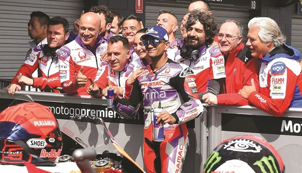 Prima Pramacu2019s Spanish rider Jorge Martin (centre) celebrates taking pole position with team crew members after the qualifying session in Phillip Island yesterday, ahead of Australian MotoGP Grand Prix. (AFP)