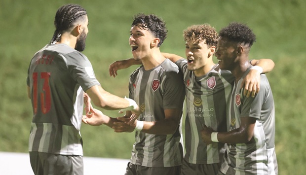 Al Duhail players celebrate after scoring against Al Shamal during the Ooredoo Cup fifth round match at the Qatar University 4 Stadium yesterday.