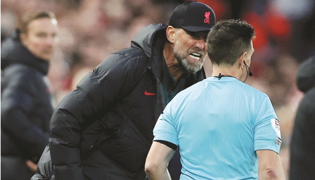 Liverpool manager Juergen Klopp remonstrates with the assistant referee during their Premier League match against Manchester City in Anfield, Liverpool, on Sunday. (Reuters)