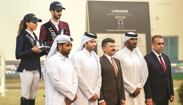 Officials pose with Big Tour winner Mohamed Khalifa Albaker and Cyrine Cherif, who claimed both runner-up and third place.