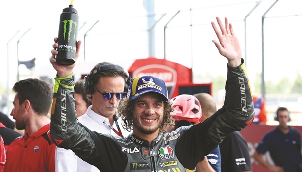 Mooney VR46 Racing Teamu2019s Marco Bezzecchi celebrates after qualifying in pole position for Thailand Grand Prix at the Chang International Circuit in Buriram, Thailand, yesterday. (Reuters)