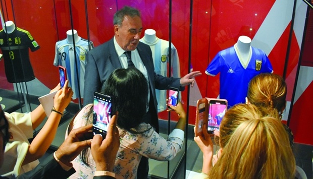 The 3-2-1 Qatar Olympic and Sports Museum curator Andrew Pearce, explaining about Diego Maradona's famous jersey (right) from 1986 World Cup quarter final match. PICTURE: Thajudheen.