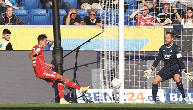 Bayern Munichu2019s Jamal Musiala scores against Hoffenheim during the Bundesliga match in Sinsheim, Germany. (Reuters)