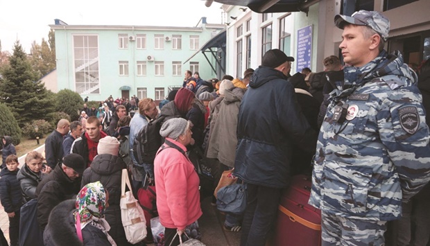 People from Kherson wait for further evacuation to Russia at the Dzhankoiu2019s railway station in Crimea.