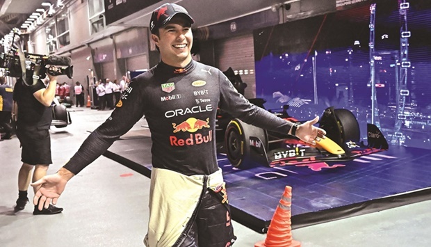 Winner Red Bull Racingu2019s Mexican driver Sergio Perez celebrates after the Formula One Singapore Grand Prix night race at the Marina Bay Street Circuit in Singapore yesterday. (AFP)