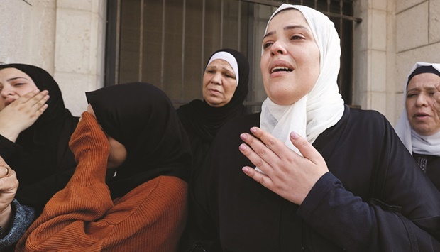 The sister of a Palestinian group member Tamer Kilani attends his funeral, after he was killed in an explosion, in Nablus in the occupied West Bank, yesterday.