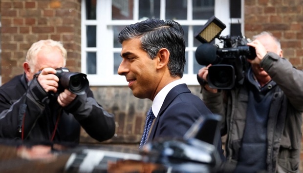 Britain's Conservative MP Rishi Sunak walks next to his campaign headquarters in London, Britain. REUTERS