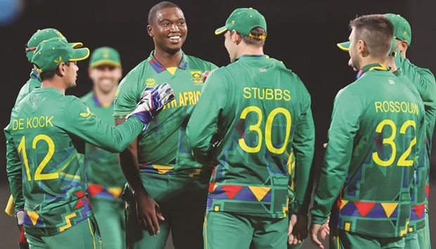 South Africau2019s Lungi Ngidi (centre) celebrates the wicket of Zimbabweu2019s Sikandar Raza with teammates during the ICC Twenty20 World Cup 2022 at the Bellerive Oval in Hobart yesterday. (AFP)
