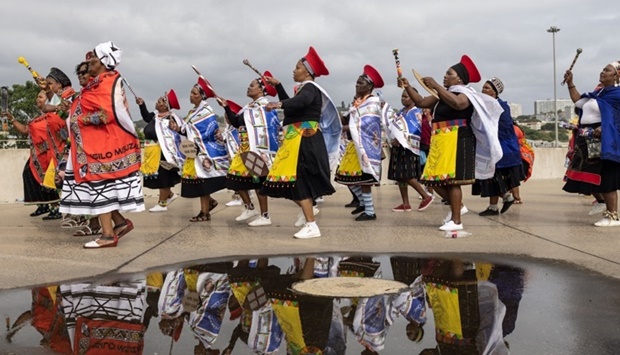 Zulu women clad in traditional dresses arrive at the Moses Mabhida Stadium in Durban on October 29, 2022, for the handover of the official certificate of recognition for the Zulu King Misuzulu.