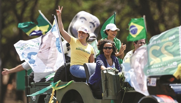 First Lady of Brazil Michelle Bolsonaro attends a motorcade as supporters of Brazilu2019s President and presidential candidate Jair Bolsonaro protest against the Supreme Court, the ministers of the Superior Electoral Court and against censorship in Brasilia yesterday. (Reuters)