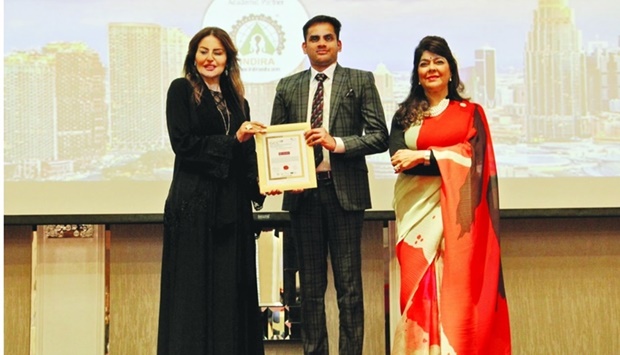 Deepak Ravindran receiving the award on behalf of Malabar Gold & Diamonds.