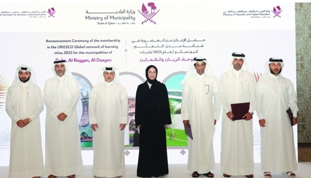HE Abdullah bin Abdulaziz bin Turki al-Subaie and HE Buthaina bint Ali al-Jabr al-Nuaimi with officials.