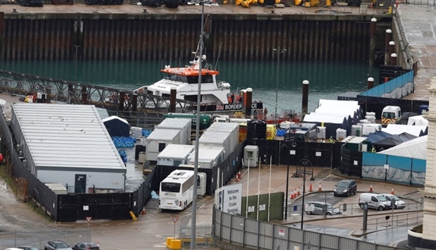 Rescued migrants disembark a Border Force vessel at the Border Force processing centre in Dover, Britain. (Reuters)