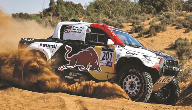 Red Bull driver Nasser al-Attiyah of Qatar and his French  co-driver Mathieu Baumel in a Toyota GR DKR Hilux at the Rallye Du Maroc yesterday.