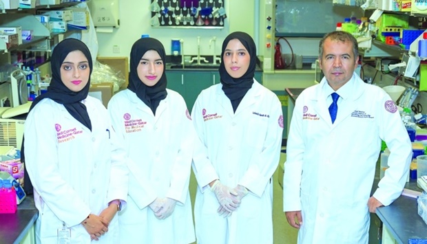 Three of the students with Dr Nayef Mazloum.