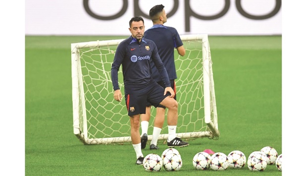 Barcelona coach Xavi during a training session at the San Siro in Milan yesterday. (Reuters)