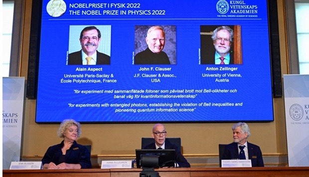Secretary General of the Royal Swedish Academy of Sciences Hans Ellegren, Eva Olsson and Thors Hans Hansson, members of the Nobel Committee for Physics announce the winners of the 2022 Nobel Prize in Physics Alain Aspect, John F. Clauser and Anton Zeilinger, during a news conference at The Royal Swedish Academy of Sciences in Stockholm, Sweden. TT News Agency/ Jonas Ekstromervia REUTERS
