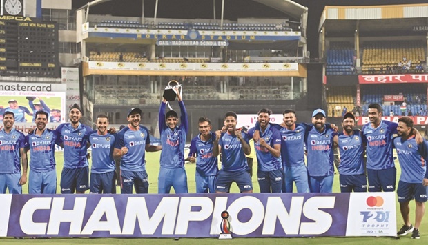Indiau2019s cricketers celebrate with the trophy after winning the series at the end of the third and final Twenty20 international against South Africa at the Holkar Cricket Stadium in Indore yesterday. (AFP)