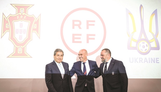 Portuguese Football Federation president Fernando Soares Gomes da Silva (left), Spanish Football Federation chief Luis Rubiales (centre) Ukraine Football Federation president Andriy Pavelko pose during a press conference announcing Spain, Portugal and Ukraineu2019s bid for the 2030 World Cup at the UEFA headquarters in Nyon. (AFP)