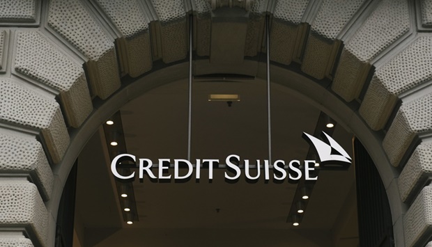 A sign above the entrance to the Credit Suisse Group headquarters in Zurich. Credit Suisse offered to buy back up to $3bn of its own debt, in a move aimed at calming investor jitters ahead of the unveiling of a crucial strategy revamp.