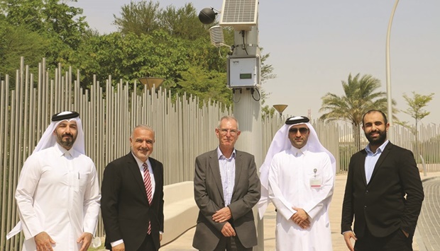Qmic, QF officials are seen with the Humidex system deployed at a QF school.