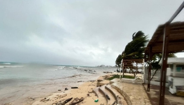 Wind blows palm trees ahead of Tropical Storm Julia in San Andres Island, Colombia, Saturday. AFP