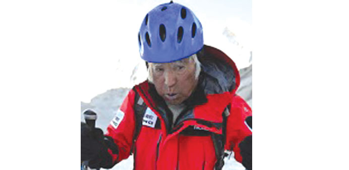 This handout picture taken on May 16, shows 80-year-old Japanese adventurer Yuichiro Miura leaving Base Camp to begin his ascent of Mount Everest in N