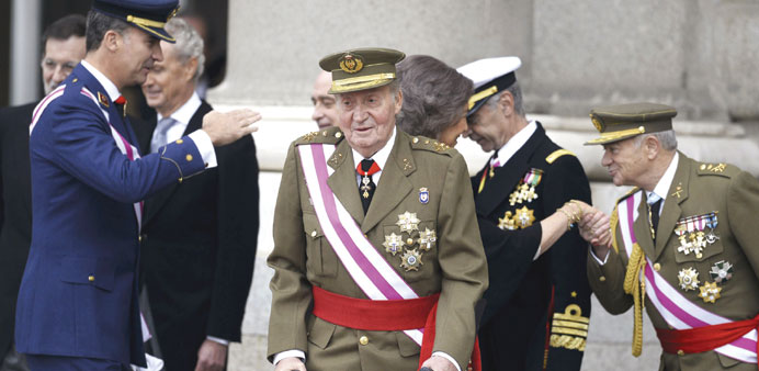 Spainu2019s Crown Prince Felipe (left), King Juan Carlos (centre) and Queen Sofia (partially obscured) attend an Epiphany Day ceremony yesterday at the Ro