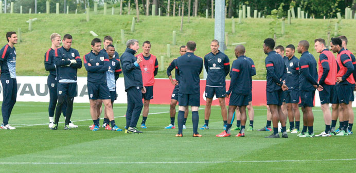 England manager Roy Hodgson (C) speaks to his players during a team training session at the Saint Georgeu2019s Park National Football Centre in Staffordsh