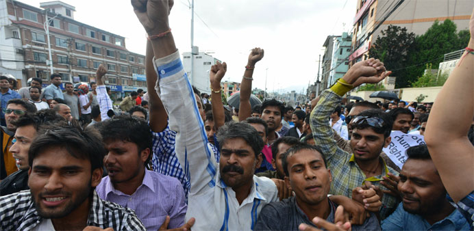 Nepalese activists of the Madhesi group chant slogans against the proposed constitutionat near parliament in Kathmandu