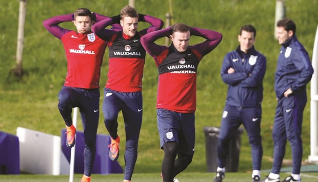 Englandu2019s Aaron Cresswell (left), Jamie Vardy (centre) and Wayne Rooney train at St. Georgeu2019s Park, Burton upon Trent, England, yesterday. (Reuters)