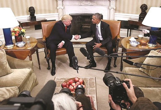SHAKING ON IT: Obama and Trump at the end of the 90-minute meeting at the White House.