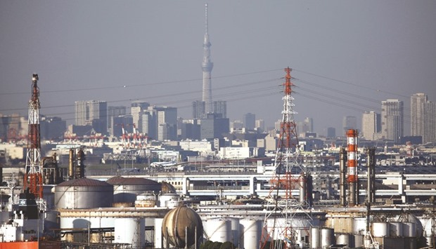 Chimneys of an industrial complex and Tokyou2019s skyline are seen from an observatory deck at an industrial port in Kawasaki. Donald Trumpu2019s stunning election victory may complicate Prime Minister Shinzo Abeu2019s efforts to revive Japanu2019s economy, underscoring the vulnerability of Abenomics to fluctuations in the yen and export profits.
