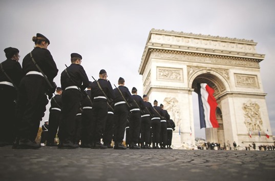 French troops are seen during a commemoration ceremony for Armistice Day, 98 years after the end of the First World War, at the Arc de Triomphe in Paris.