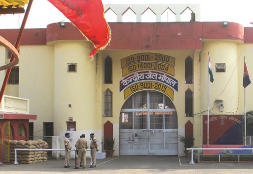 Police gather at the entrance to the Central Jail in Bhopal yesterday, a day after eight SIMI members escaped and were killed in an encounter with security personnel.