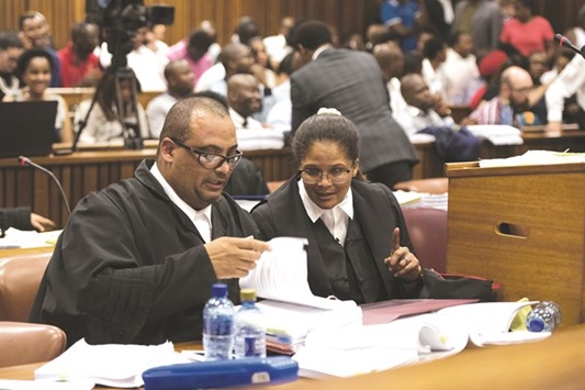 Lawyers Anthea Platt and Myron Dewrance representing South African President Jacob Zuma, look through documents during a hearing at the High Court in Pretoria yesterday.