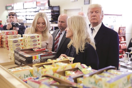 Republican presidential nominee Donald Trump, his daughter Tiffany Trump, and his campaign manager Kellyanne Conway shop at a Wawa gas station yesterday in Valley Forge, Pennsylvania.