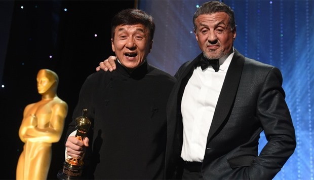 Honoree Jackie Chan (L) poses with actor Sylvester Stallone
