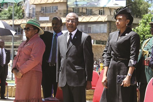 Lesotho Prime Minister Pakalitha Mosisili (centre) and Queen u2018Masenate Mohato Seeiso (right) attend an official ceremony yesterday to remember Basotho-born soldiers who perished during World War I and II at Makonyane memorial square in Maseru.