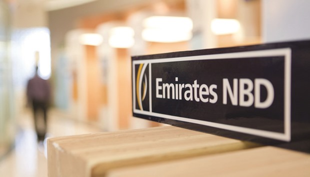 A logo sits on display inside an Emirates NBDu2019s bank branch in Dubai. The banku2019s consumer lending book has grown by 10% since the end of 2015 and it is aiming for full-year loan growth of mid to high single digits next year across the bank.