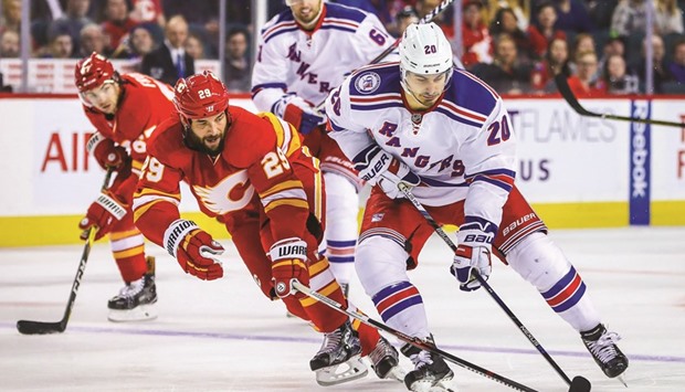 New York Rangers left wing Chris Kreider (No 20) and Calgary Flames defenseman Deryk Engelland (No 29) battle for the puck during the third period at Scotiabank Saddledome. New York Rangers won 4-1. PICTURE: USA TODAY Sports